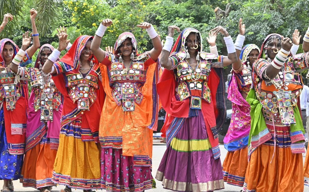 Tribal women performing a cultural dance on the occasion of World Adivasi Day, at Tummalapalli Kalakshetram in Vijayawada on Friday.