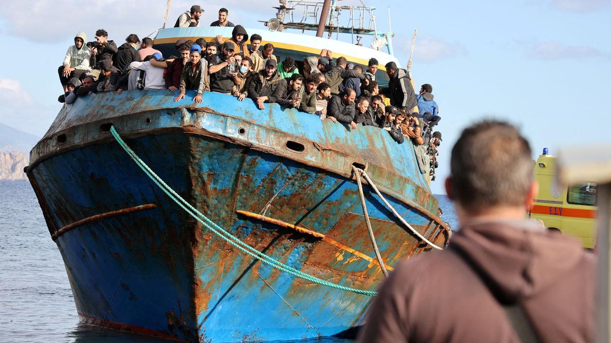 More than 100 migrants rescued from capsized fishing vessel, in Greece