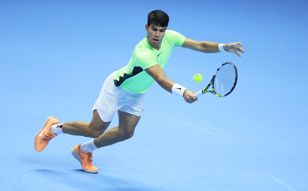 Carlos Alcaraz of Spain plays a backhand against Andrey Rublev during the Men’s Singles Round Robin match on day four of the Nitto ATP Finals at Pala Alpitour on November 15, 2023 in Turin, Italy.