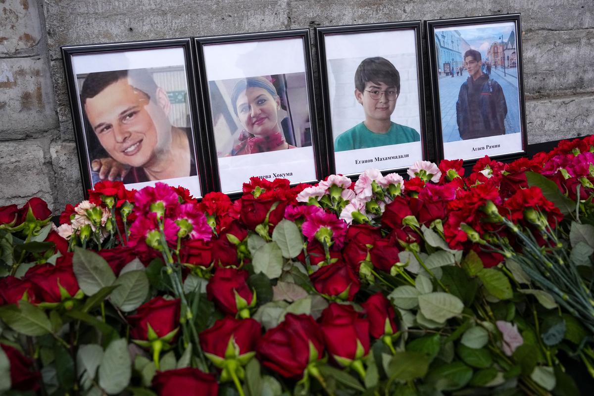 Flowers and portraits are placed at the Consulate of Azerbaijan in the memory of victims of the Azerbaijan Airlines’ Embraer 190 that crashed near the Kazakhstan’s airport of Aktau, in St. Petersburg, Russia, Thursday, on December 26, 2024.