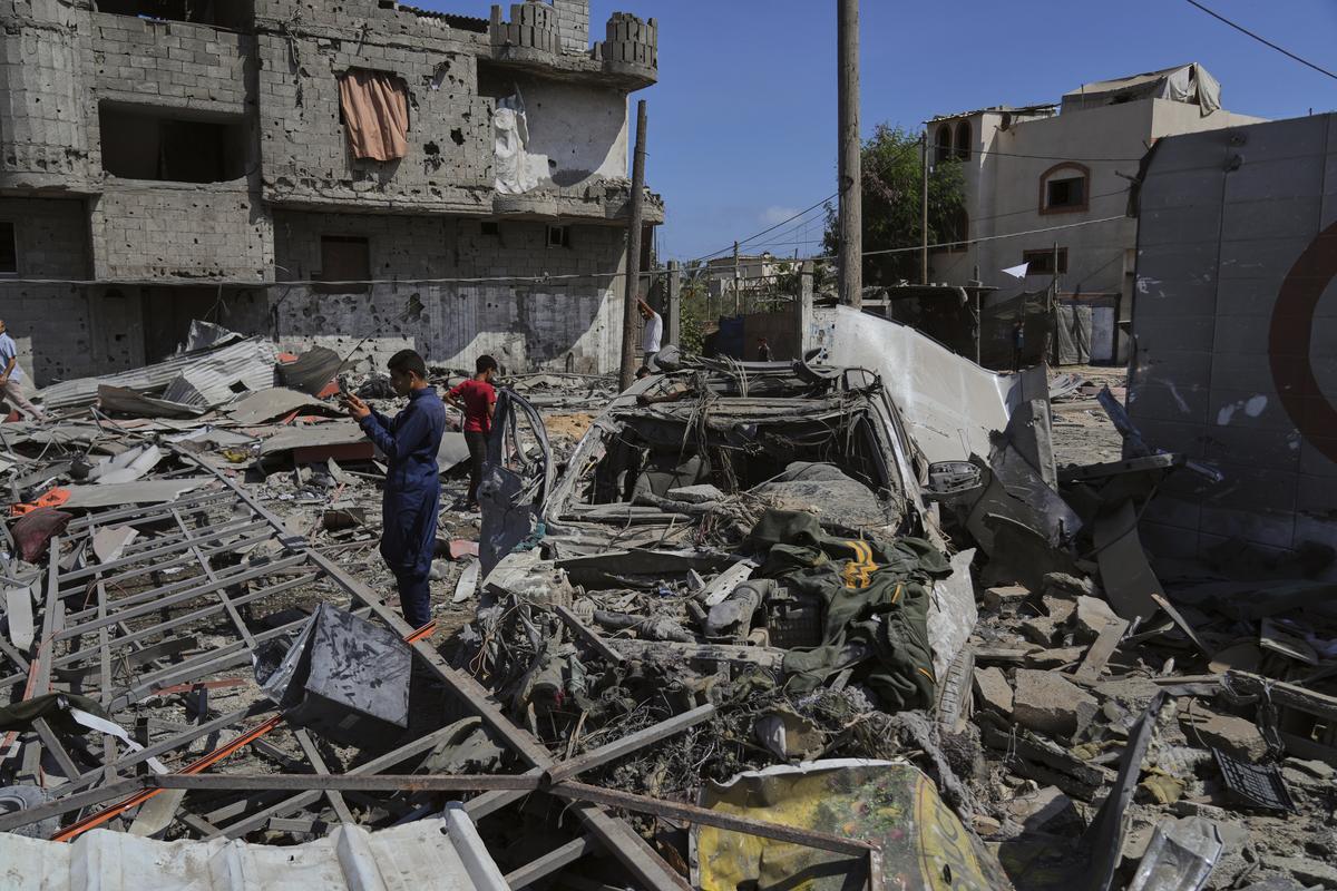 Palestinians inspect the wreckage of a gas station destroyed in an Israeli airstrike in Deir al-Balah, central Gaza Strip, on July 12, 2025. Palestinians inspect the wreckage of a gas station destroyed in an Israeli airstrike in Deir al-Balah, central Gaza Strip, on July 12, 2025.