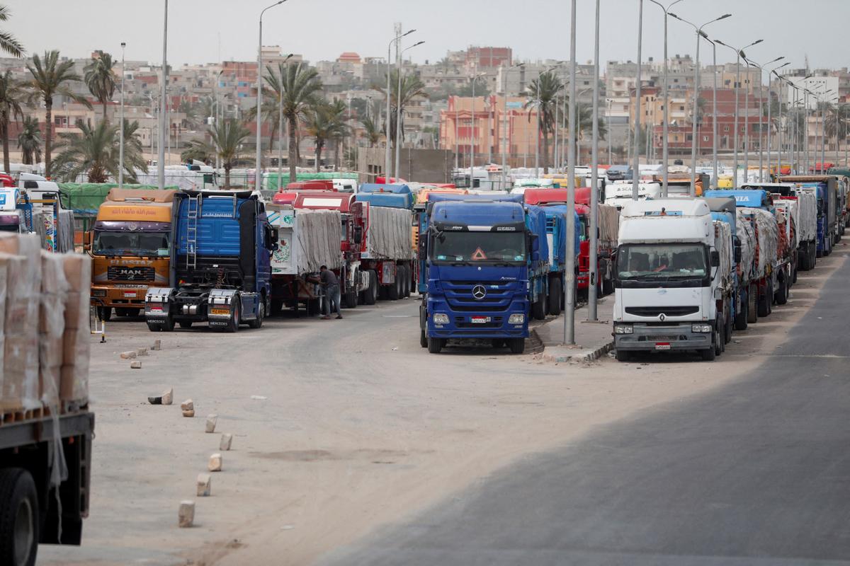 Trucks stand at the Rafah border crossing between Egypt and the Gaza Strip, amid the ongoing conflict between Israel and Palestinian Islamist group Hamas, in Rafah, Egypt, on April 25, 2024. 