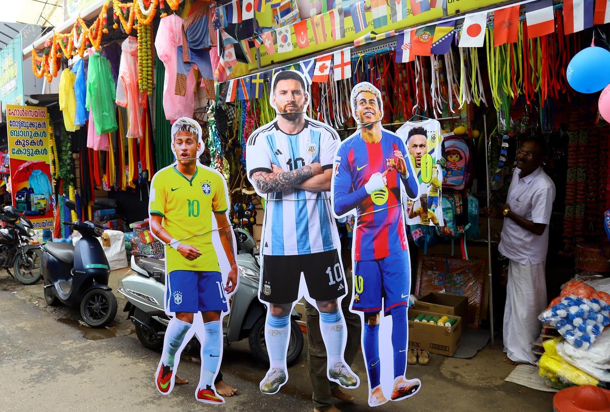 Cutouts of football stars welcome shoppers in Thrissur, Kerala, May 2026.