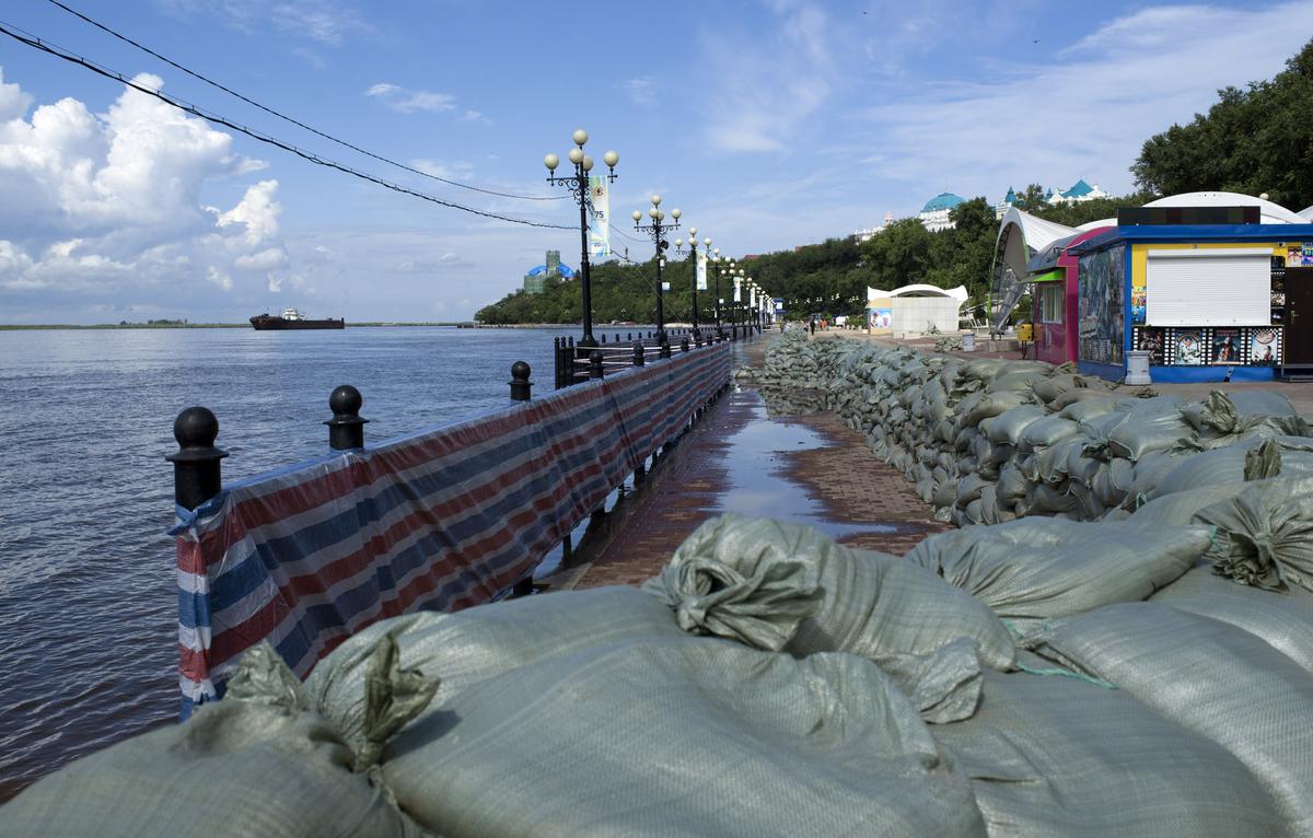 Protective sandbags are placed on the bank of the flooded Amur River in Khabarovsk, Russia. 