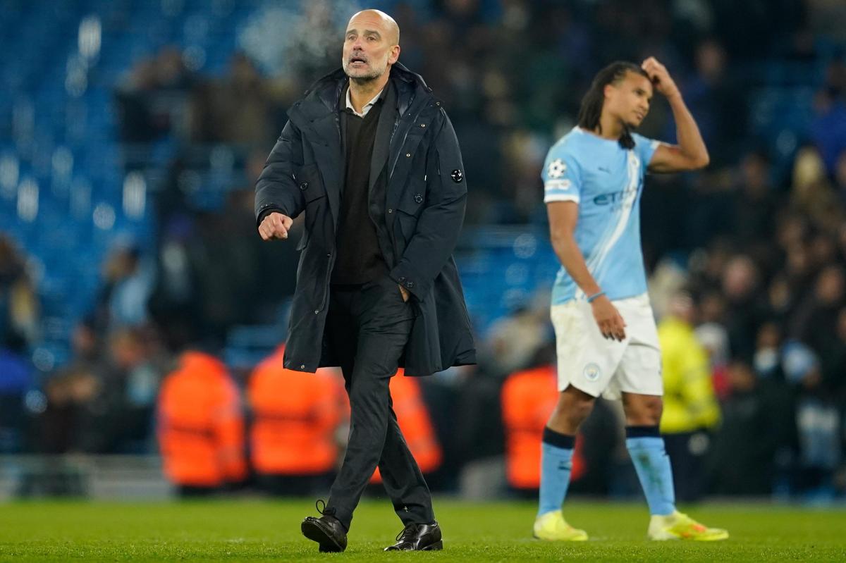 Manchester City's head coach Pep Guardiola walks on the pitch after his team’s loss to Bayer Leverkusen in the Champions League