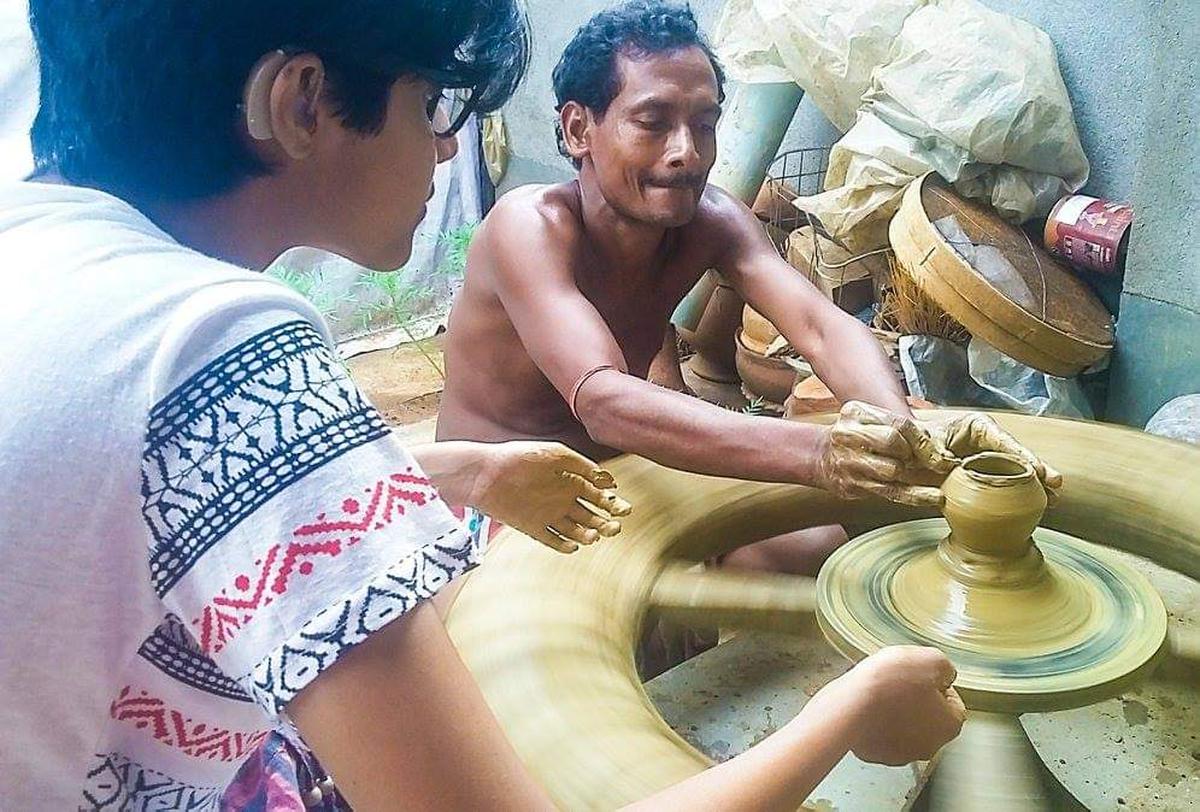 Srijoni at Panchmura with a potter’s family  