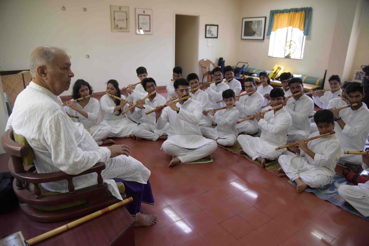  Pt. Chaurasia watching his students perform  at Vrindaban Gurukul in Mumbai.