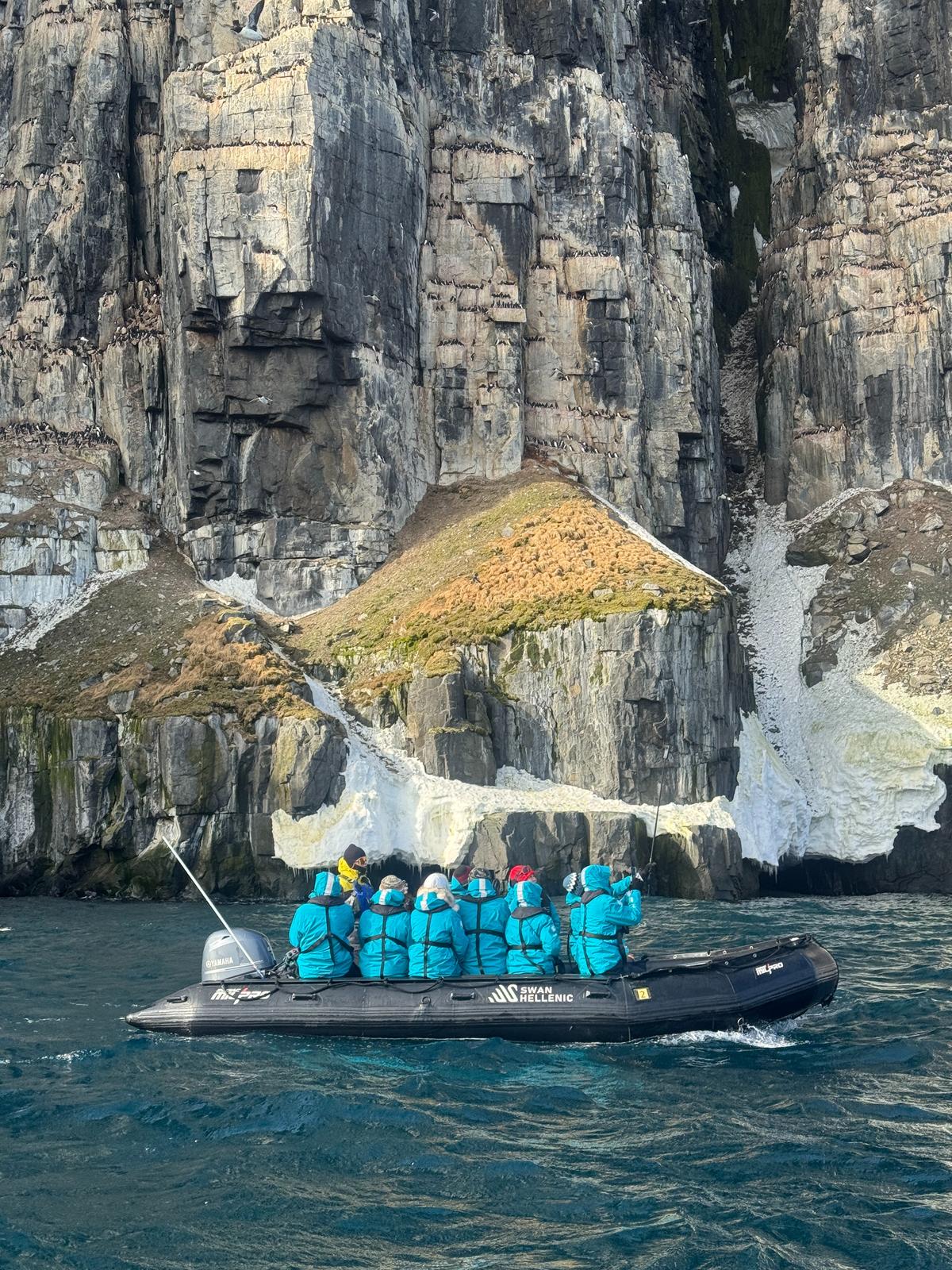 The friends on a Zodiac excursion at the Arctic The friends on a Zodiac excursion at the Arctic