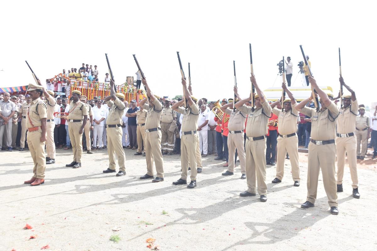 Police fire rounds in the air during the last rites of D. Srinivas in Nizamabad.