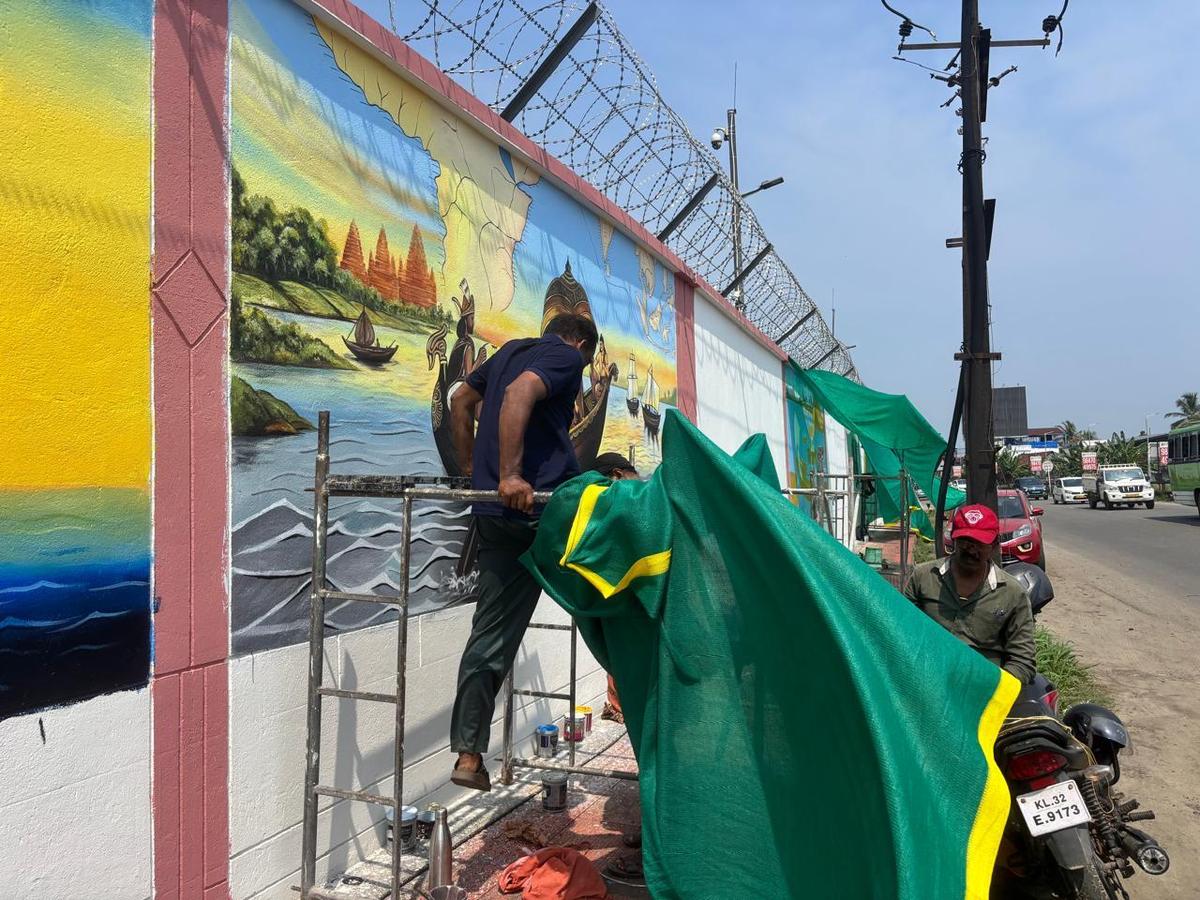 An artist working on the mural