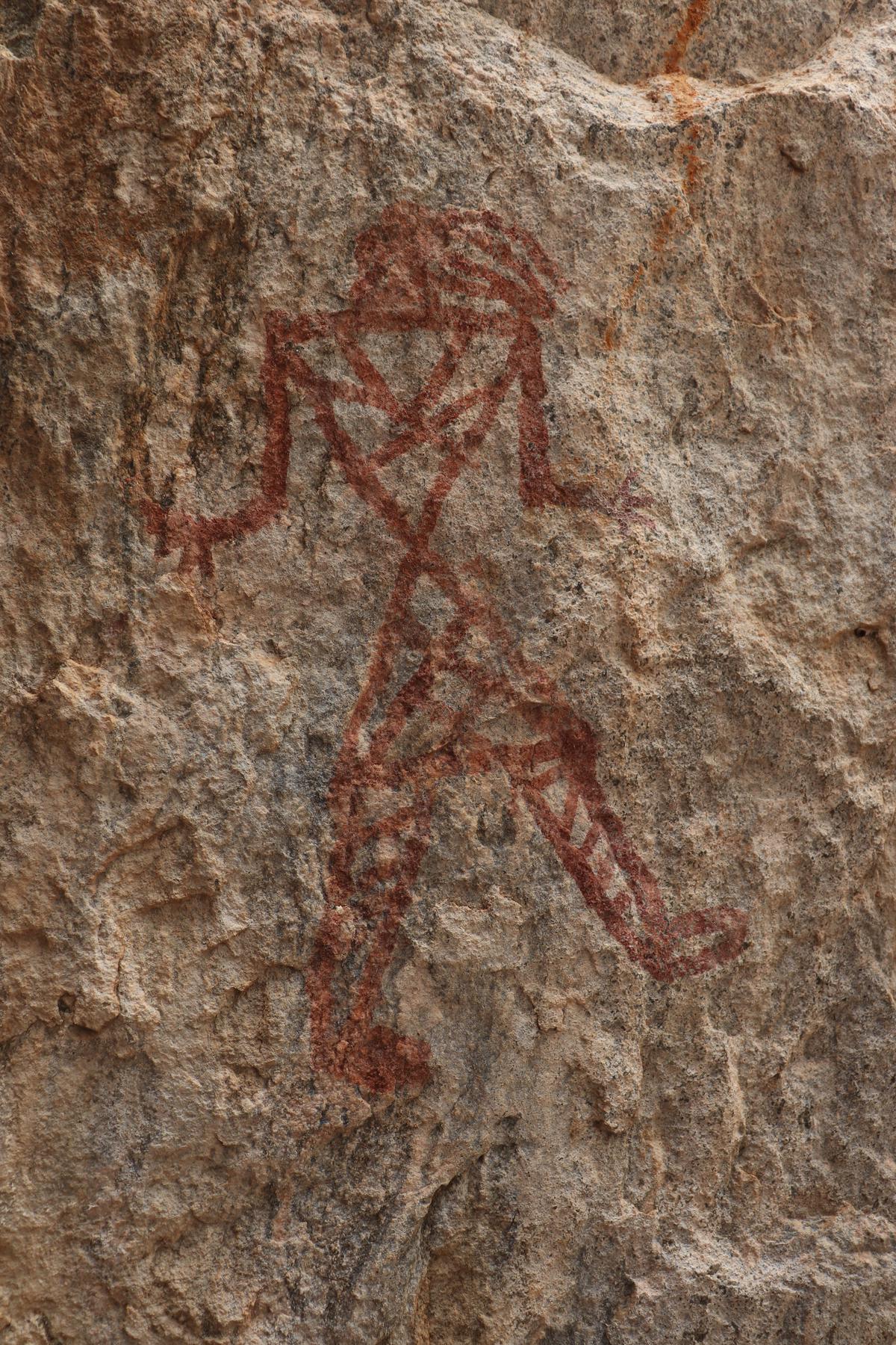 Fascinating rock art: Bird faced man in Azhagar Hills done in red ochre