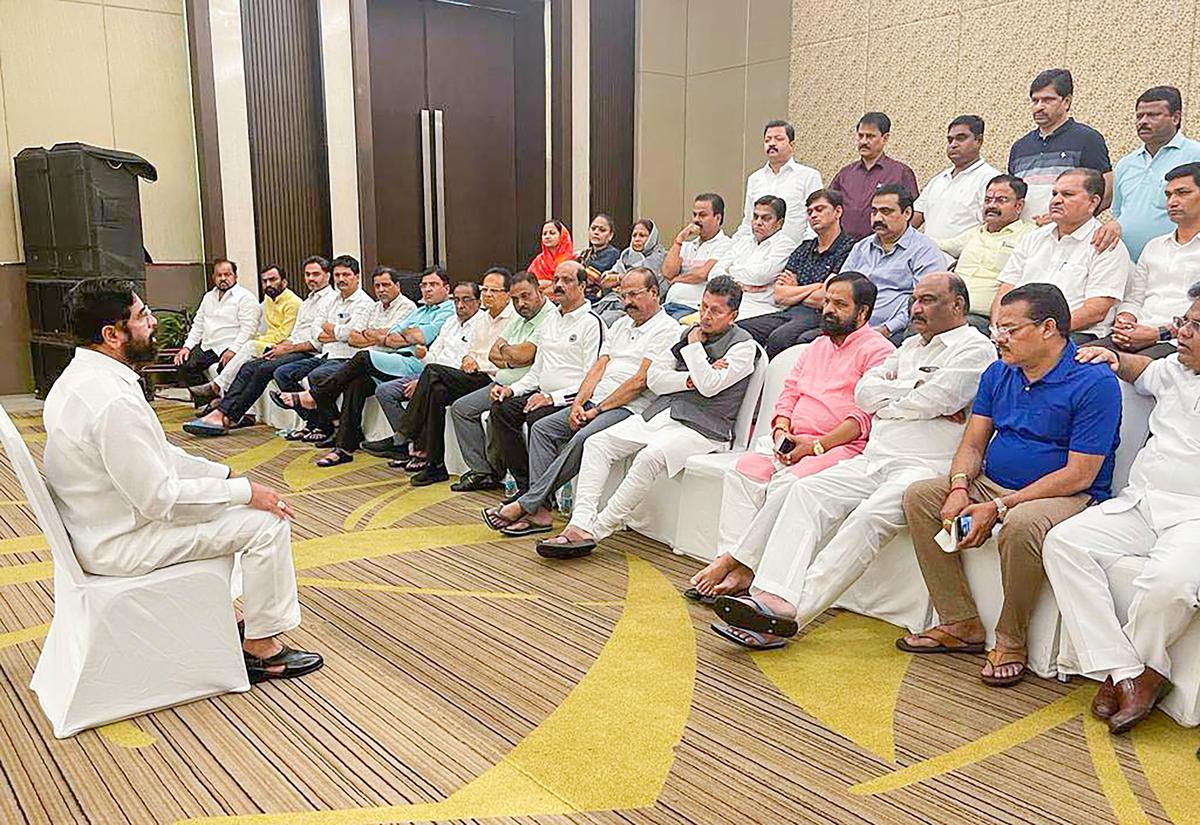 Shiv Sena leader Eknath Shinde with the group of rebel MLAs at a hotel in Guwahati. 