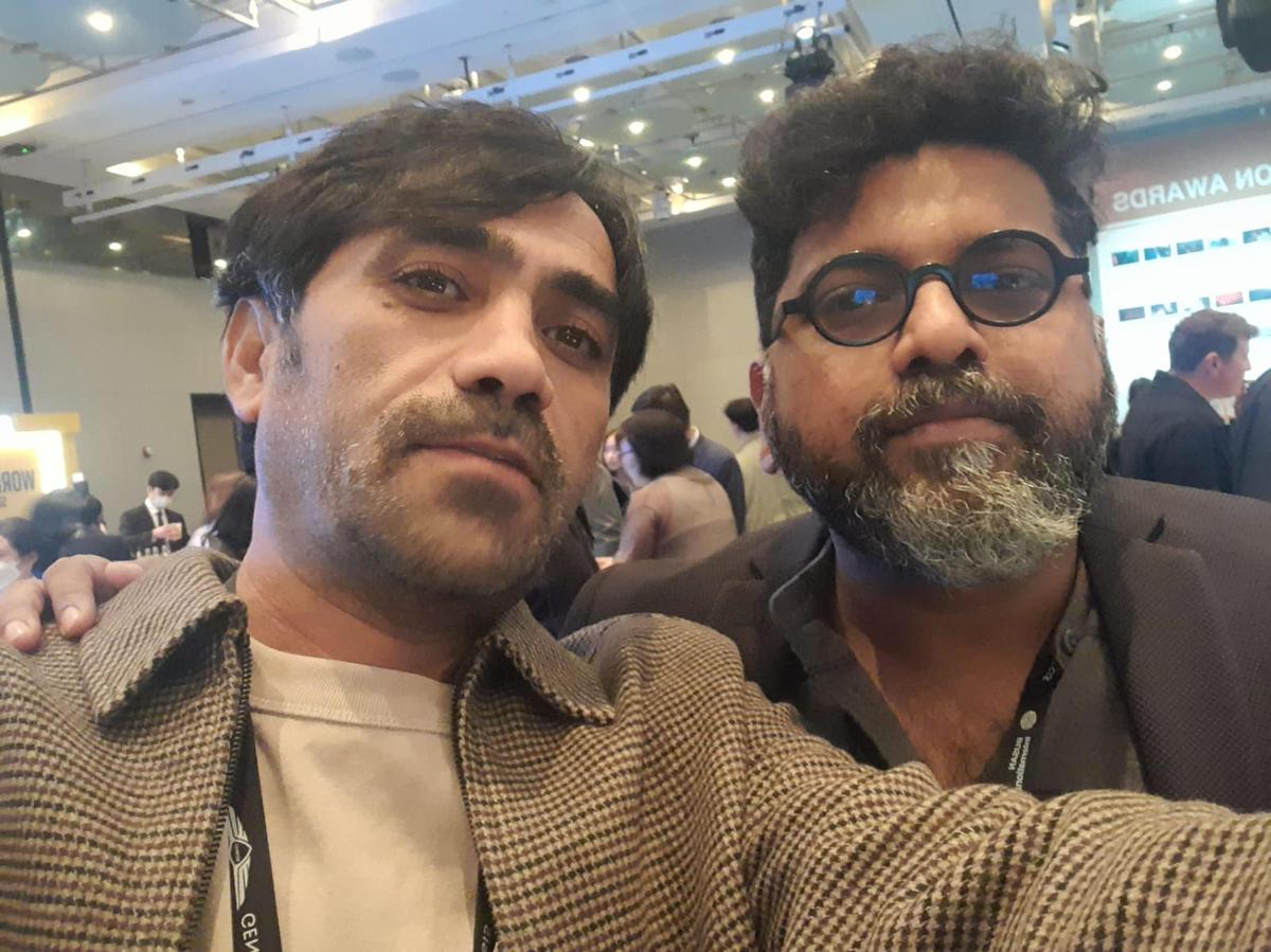 Mahesh Narayanan with Iranian director Hadi Mogheg (left), whose film Saint of Wind opened Busan and won the Kim Jacques Award.