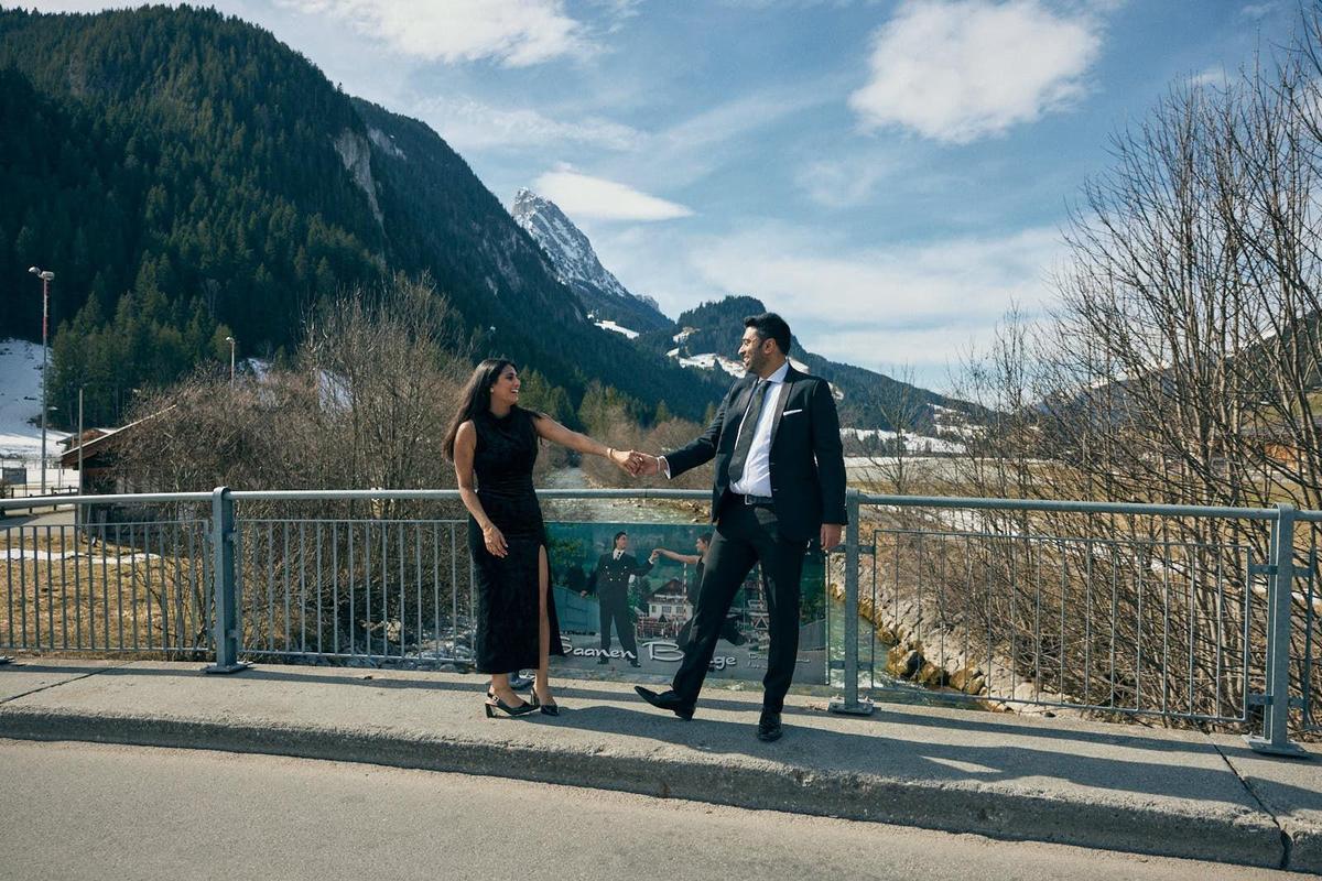 A couple enacting a scene from DDLJ on Saanen bridge A couple enacting a scene from DDLJ on Saanen bridge