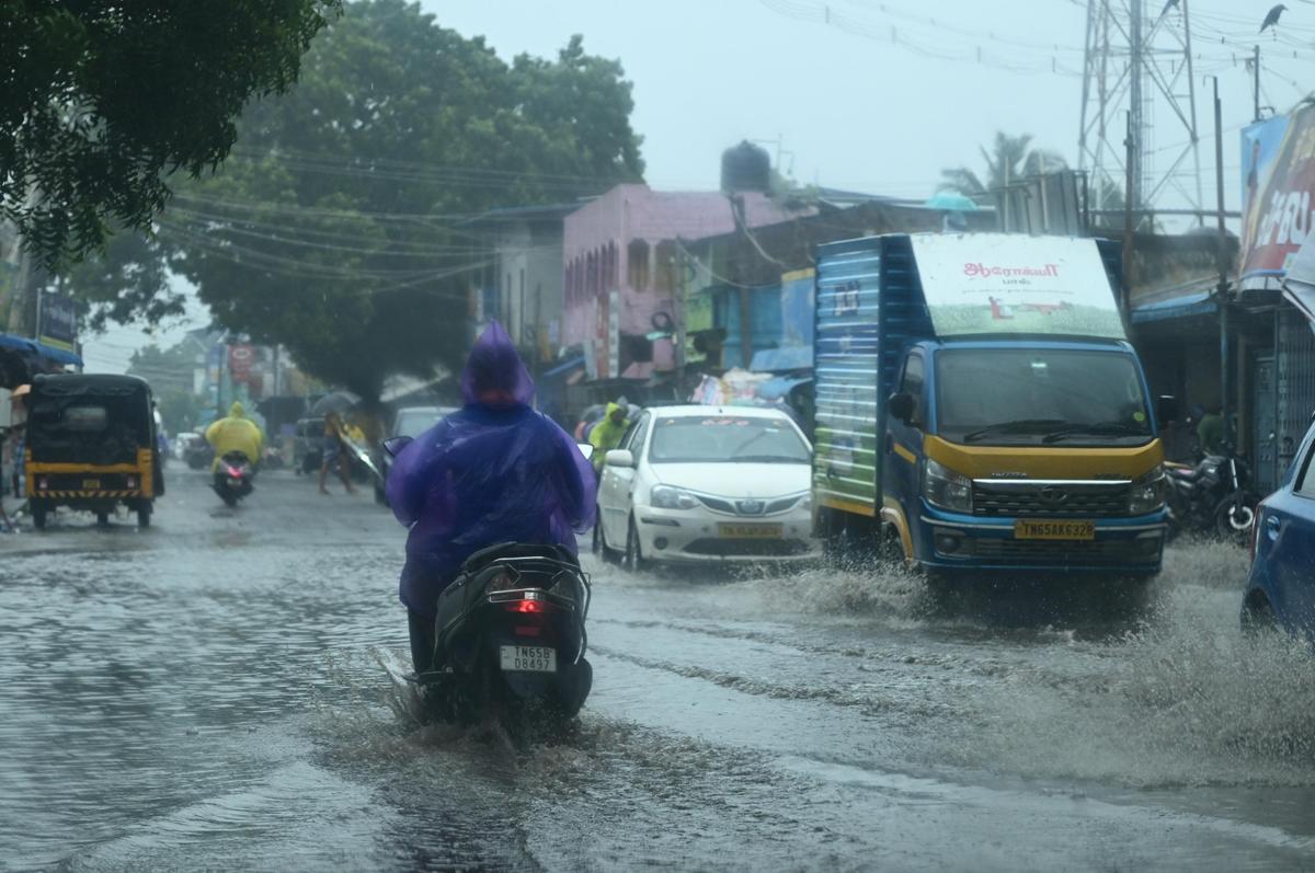Rainwater flows on Rameswaram road at Thangachimadam on Saturday. 