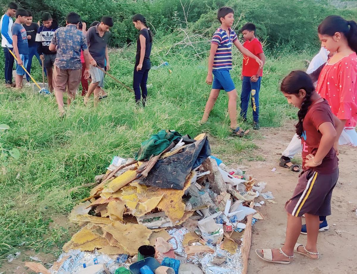After a long gap, children resume cleaning drive on Krishna river bank