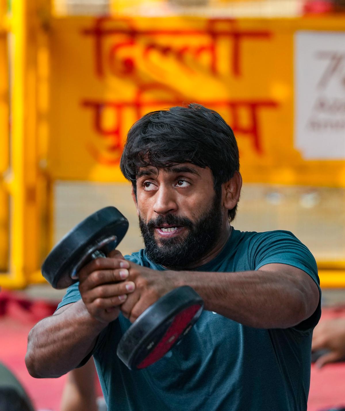 Wrestler Bajrang Punia exercises near Jantar Mantar during a protest, in New Delhi, on Thursday, April 27, 2023. 