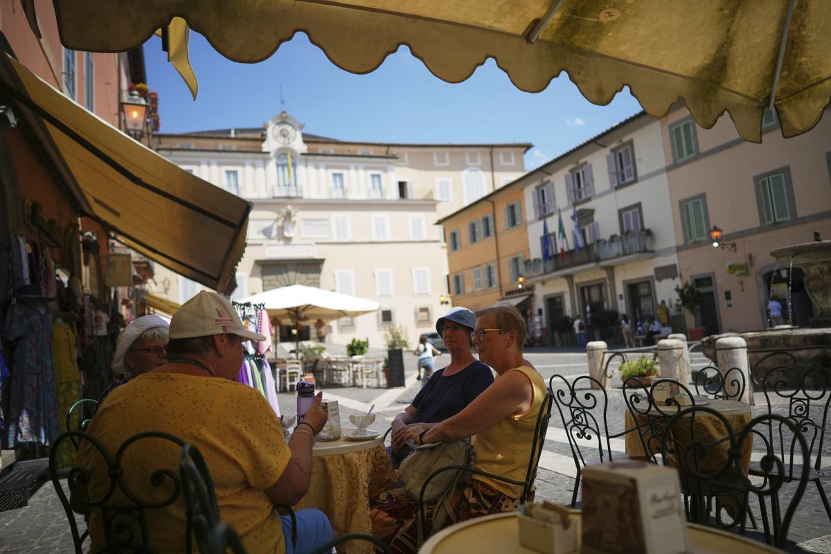 The Papal or Apostolic Palace in the background as tourists enjoy drinks in the town of Castel Gandolfo, a historic summer retreat for popes about 30 kilometres southeast of Rome, where Pope Leo XIV will spend a short period of rest. The Papal or Apostolic Palace in the background as tourists enjoy drinks in the town of Castel Gandolfo, a historic summer retreat for popes about 30 kilometres southeast of Rome, where Pope Leo XIV will spend a short period of rest.