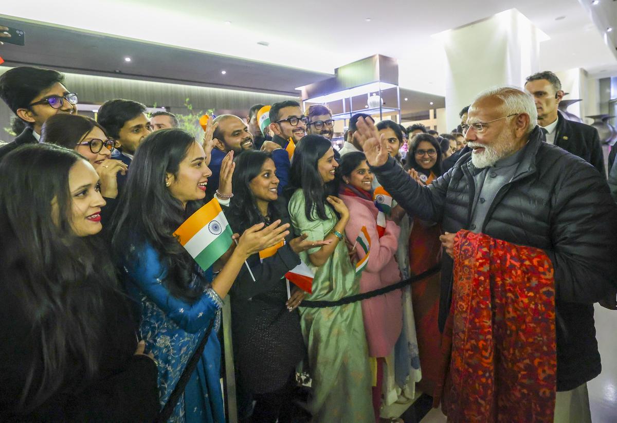 Prime Minister Narendra Modi being received by the Indian community on his arrival at Marseille Provence airport in Marignane, southern France, after the Artificial Intelligence Action Summit in Paris.