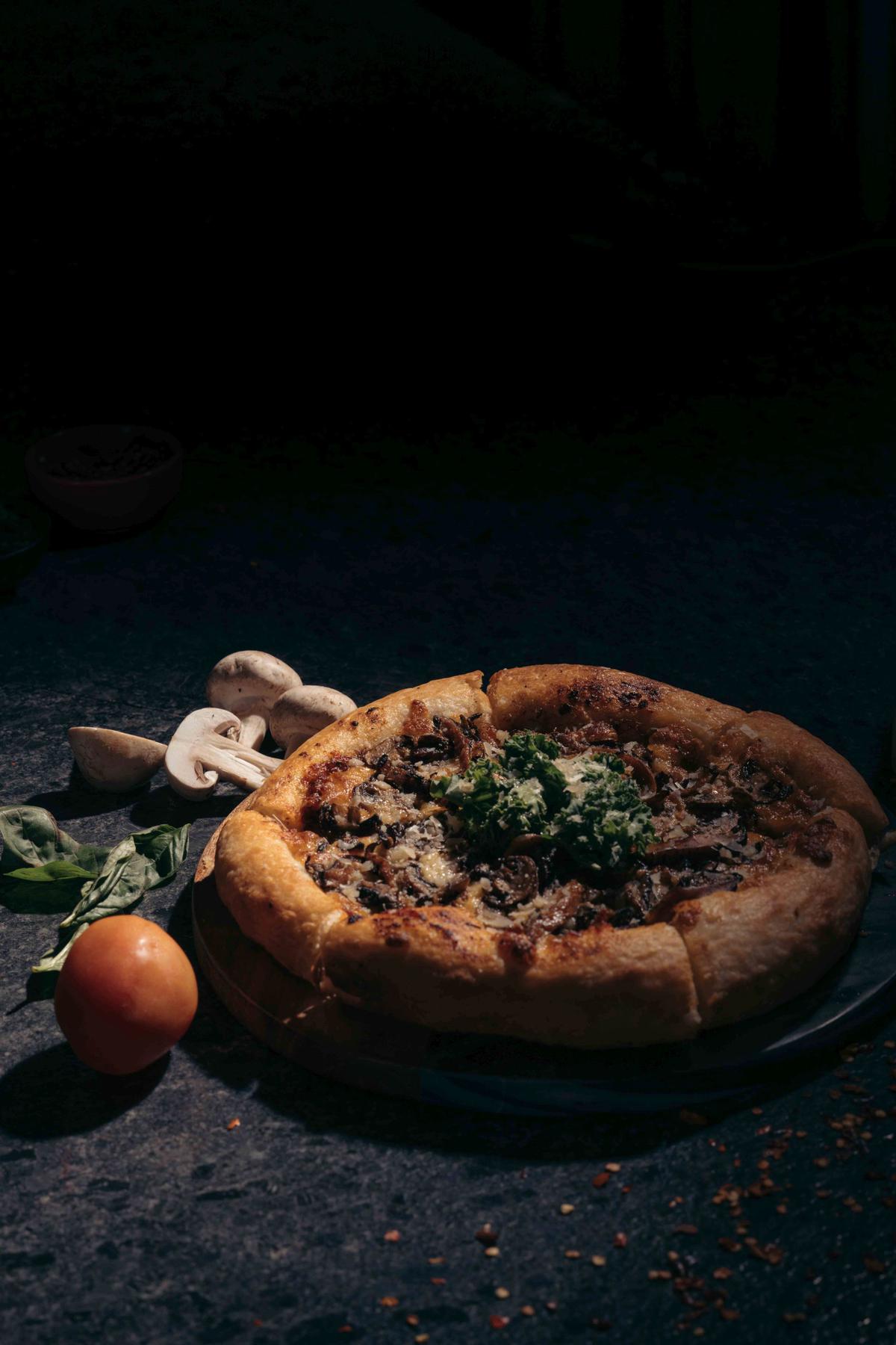 Pizza with wild mushroom pesto, mozzarella and truffle oil 