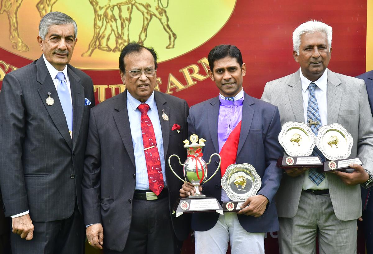 P.G. Belliappa and BTC chairman Shiv Kumar Kheny with Success’ jockey Suraj Narredu and trainer Vijay Singh after the filly claimed the the St. Leger on Sunday in Bengaluru on July 23, 2023. Photo MURALI KUMAR K / The Hindu