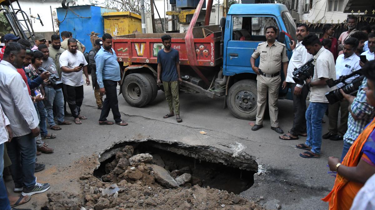Road caves in under the weight of a tipper in Himayatnagar