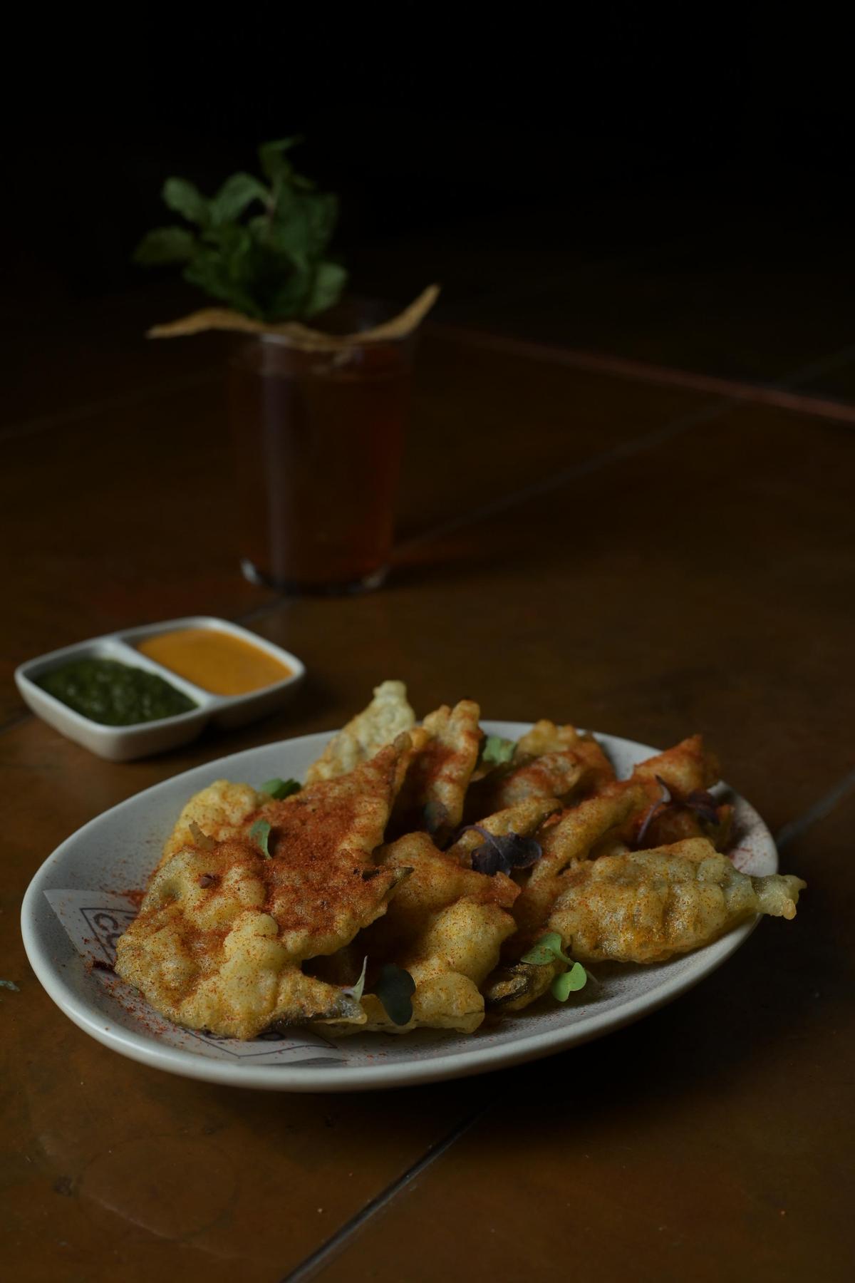 A suleimani old fashioned served with gongura tempura