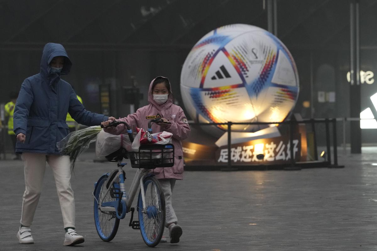Watching cheering fans, China’s World Cup viewers question country’s COVID policy