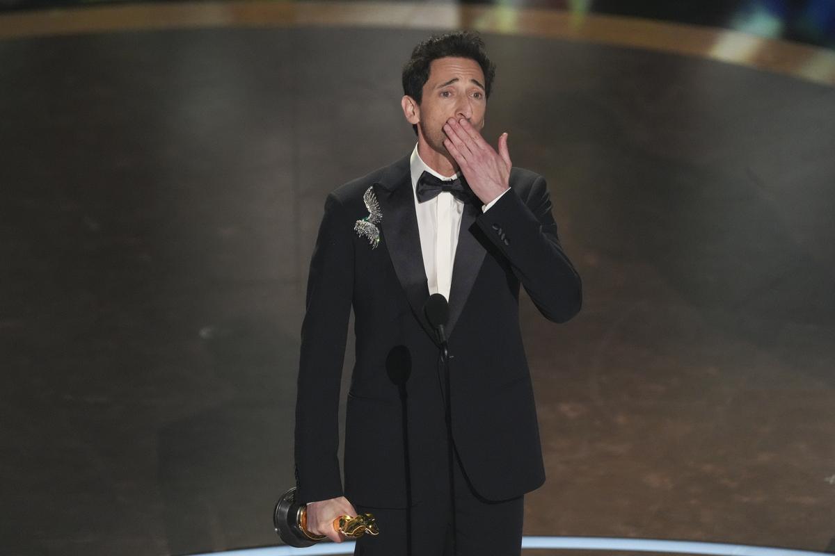 Adrien Brody accepts the award for best performance by an actor in a leading role for “The Brutalist” during the Oscars on Sunday, March 2, 2025, at the Dolby Theatre in Los Angeles.