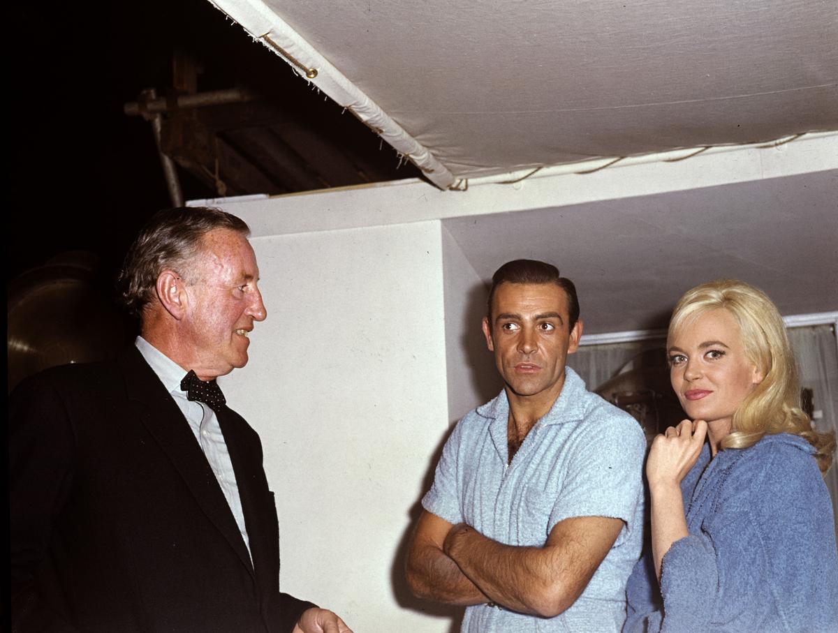 On the set of the James Bond movie Goldfinger.  (From left to right) Author Ian Fleming, actor Sean Connery and actress Shirley Eaton.