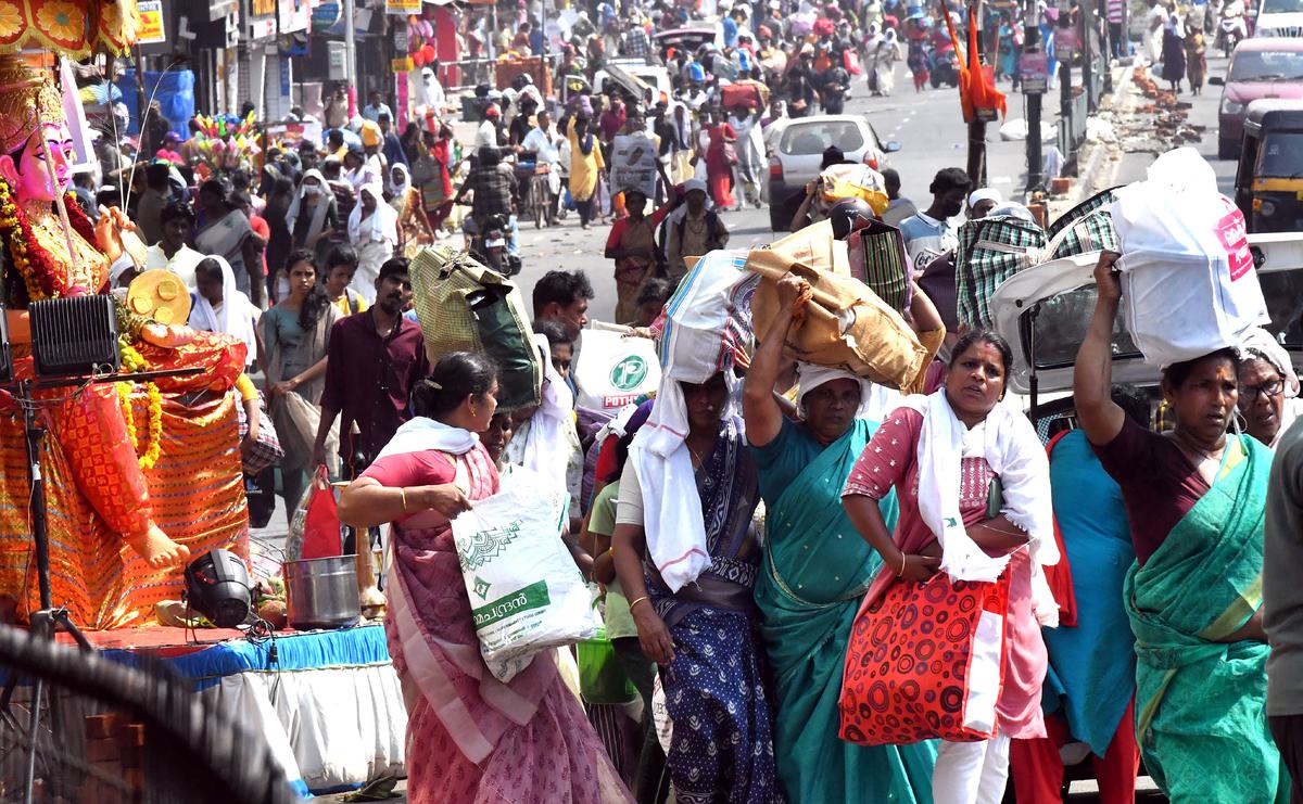 Devotees return after offering  annual Attukal Pongala  in Thiruvananthapuram on Tuesday.
 