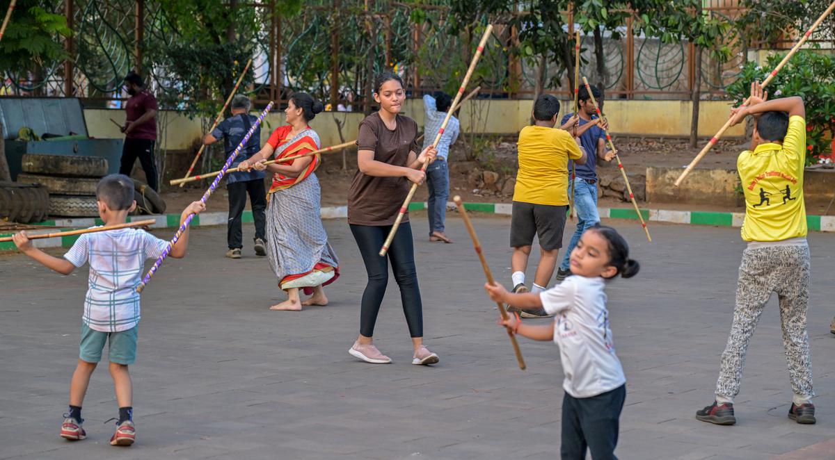 People practicing karrasamu, a traditional martial arts sport of Andhra Pradesh, at VMRDA Central Park in Visakhapatnam. 