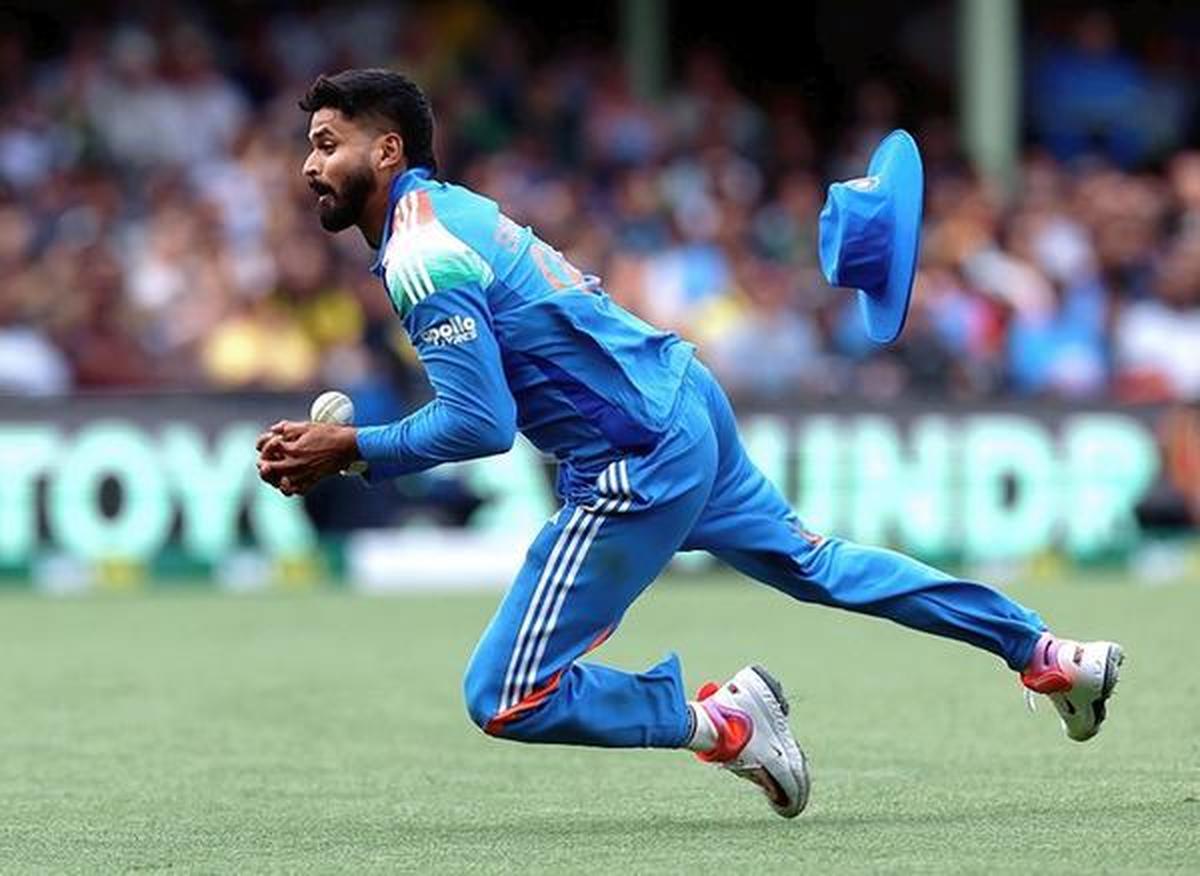 India's Shreyas Iyer takes a catch to dismiss Australia's Alex Carey.