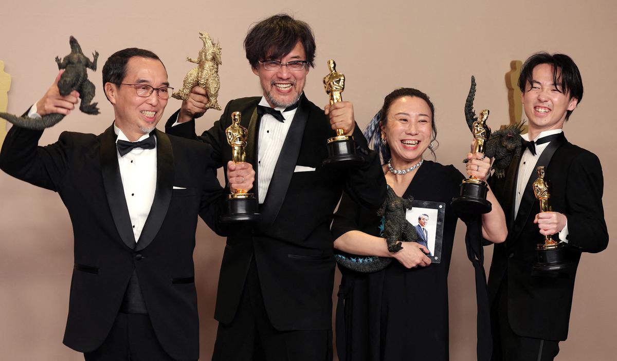 Takashi Yamazaki, Kiyoko Shibuya, Masaki Takahashi and Tatsuji Nojima pose with their Oscars for Godzilla: Minus One     