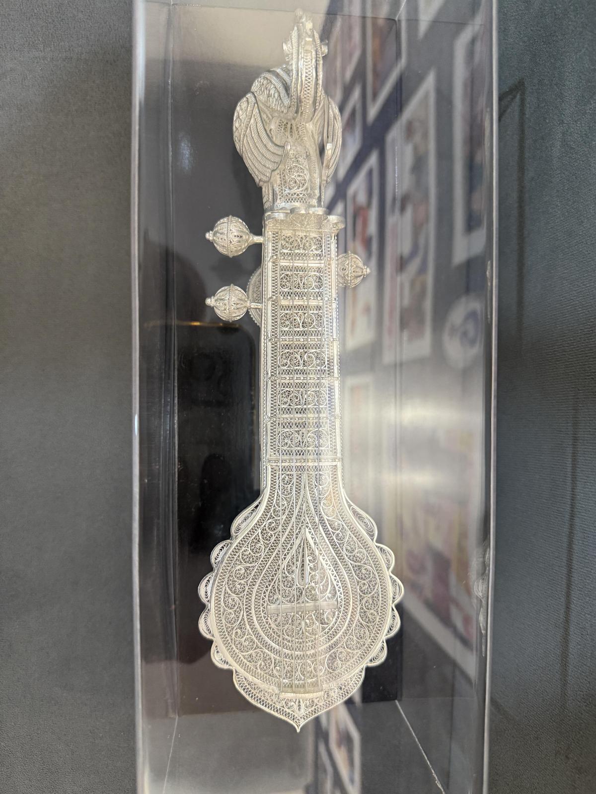 An exquisitely crafted veena in silver filigree style by craftsmen from Karimnagar.