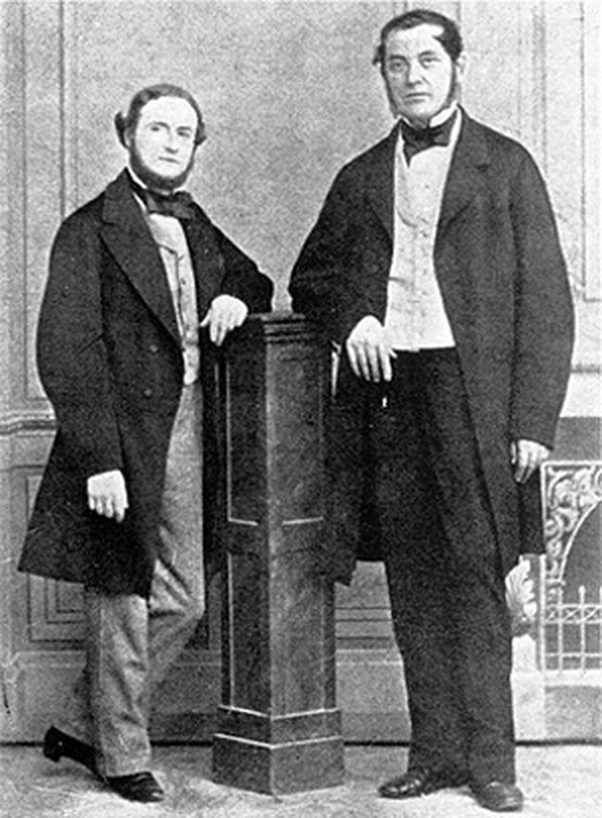 Kirchhoff (left) standing alongside Bunsen. Kirchhoff (left) standing alongside Bunsen.