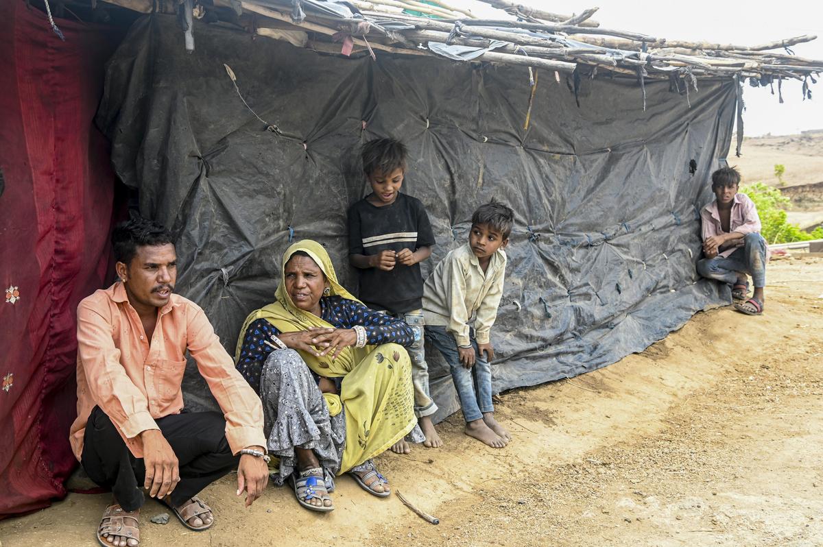 Shanno Bai, who lost her husband Van Singh Araadi in police firing during the 2003 communal clashes, with her son, Vikram (on the left), in Urdya Baida village. Shanno Bai, who lost her husband Van Singh Araadi in police firing during the 2003 communal clashes, with her son, Vikram (on the left), in Urdya Baida village.