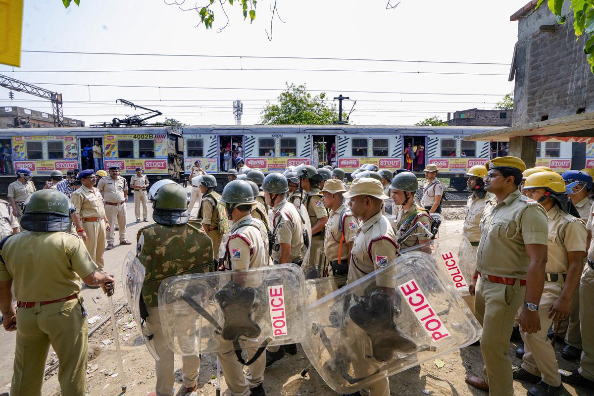 Security personnel deployed near Rishra railway station amid tension following clashes between two groups during a Ram Navami procession, in Hooghly district on Sunday, April 4, 2023. 