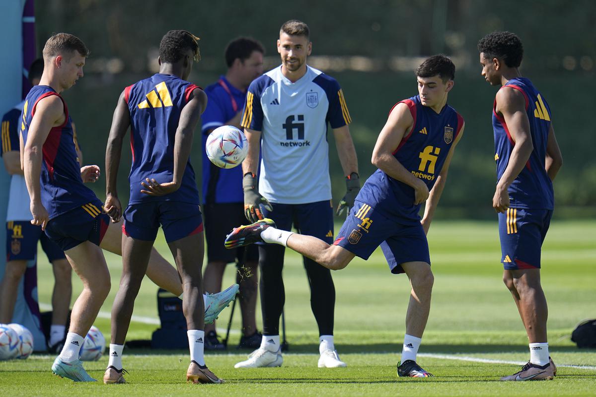 Spain players, from left, Dani Olmo, Nico Williams, goalkeeper Unai Simon, Pedri and Alejandro Balde work out during a training session at Qatar University in Doha, Qatar on November 24, 2022.