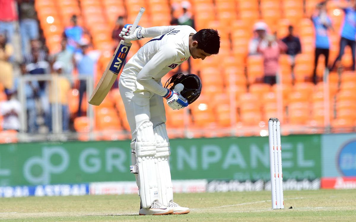 Humble gesture: Gill bows to the crowd on reaching his century.