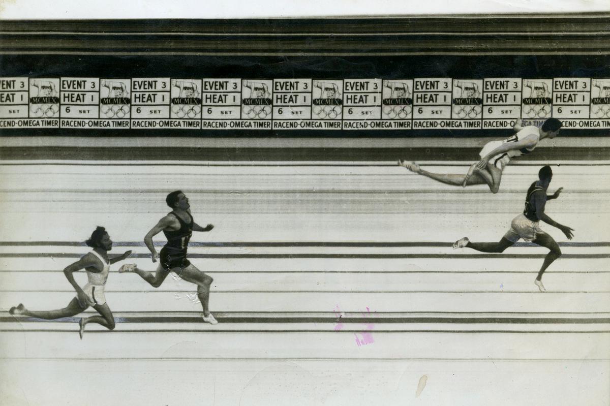 The official photo finish of the 400m final at the Olympic Games in Rome on September 06, 1960. It shows Otis Davis of the U.S. (nearer, right) turning his head as Carl Kaufmann of Germany lunges at the tape with his head. This trick, which gave Lee Calhoun of the U.S. the high hurdles title, failed to work for Kaufmann. The judges awarded the race to Davis but gave both athletes the world record smashing time of 44.9s. Malcolm Spence of South Africa is third in 45.5 and India’s Milkha Singh fourth in 45.6.