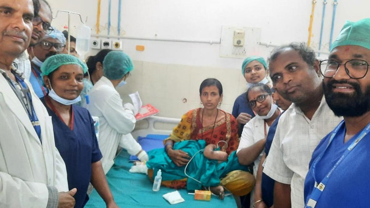 Satwik and his mother with doctors in the Vijayapura District Hospital after the rescue on Thursday.