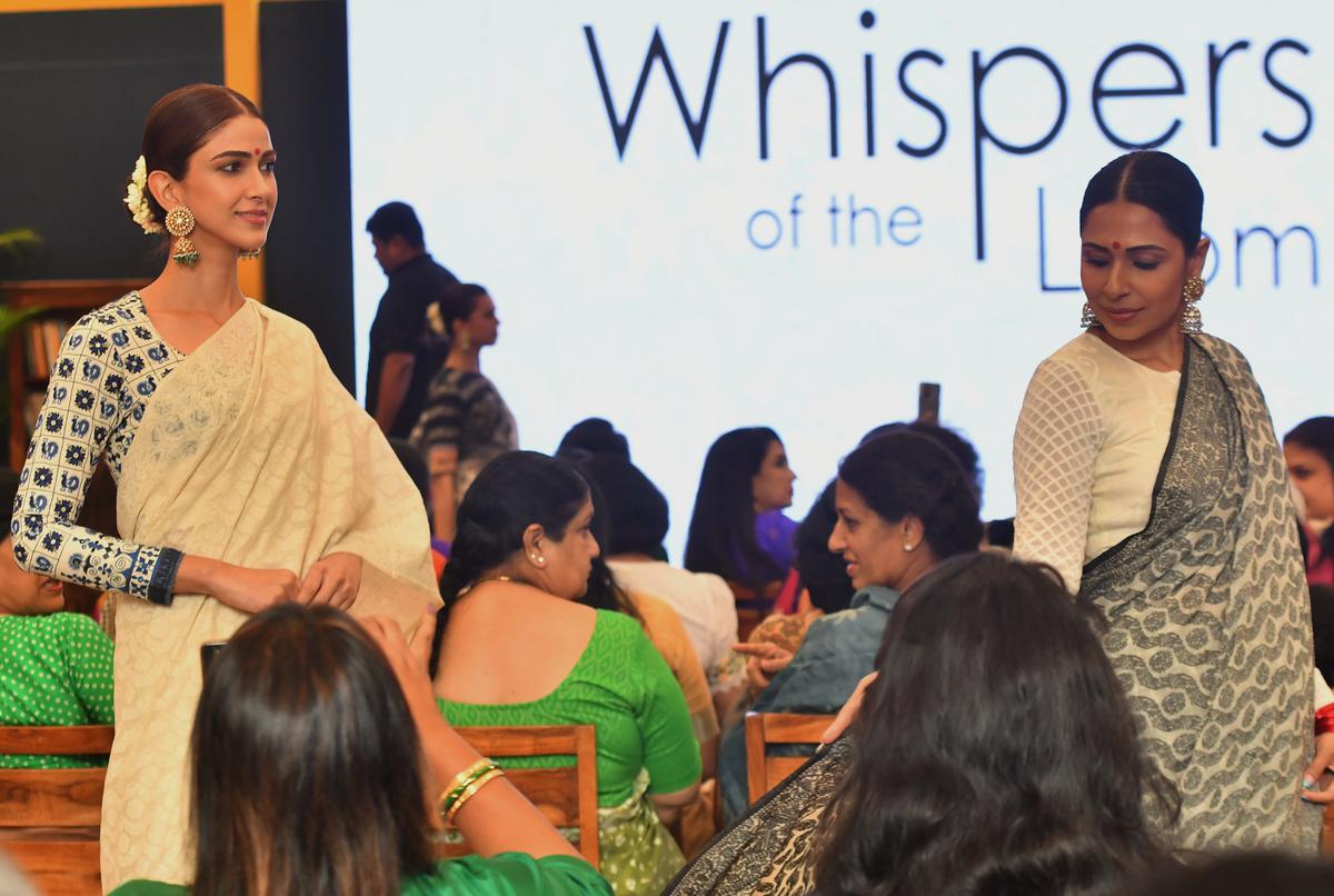 Reha Sukheja (left) showcases a fine muslin Dhakai jamdani sari that took four years to weave