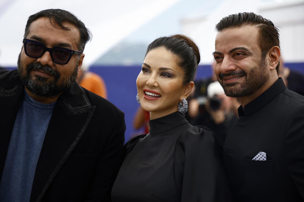 Director Anurag Kashyap, cast members Rahul Bhat and Sunny Leone pose at Cannes