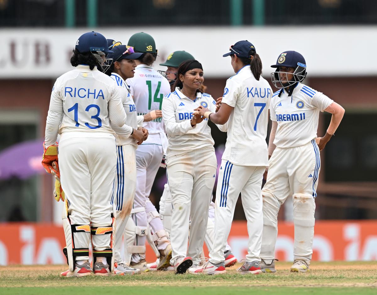 India’s Rajeshwari Gayakwad celebrates with teammates after taking the wicket of South Africa’s Captain Laura Wolvaardt during the lone test match between South Africa and India at M.A Chidambaram Stadium, Chepauk in Chennai on July 1, 2024. 