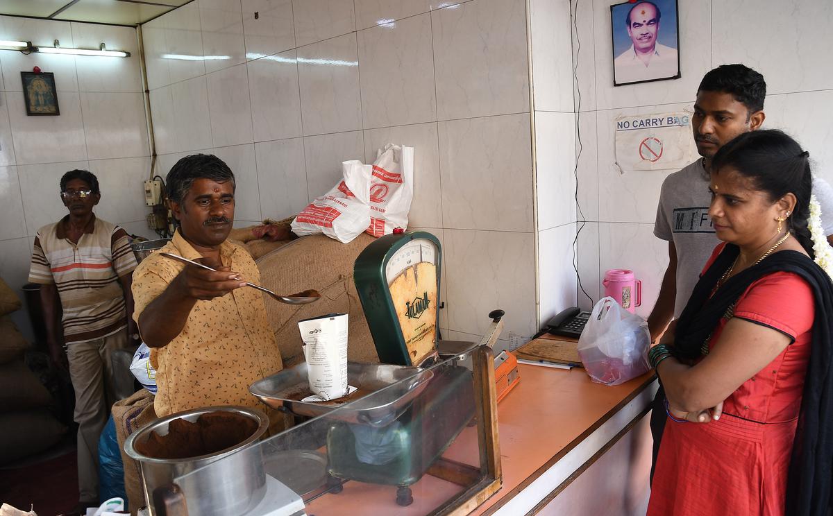 Customers line up to purchase coffee powder at Sundaram Coffee.