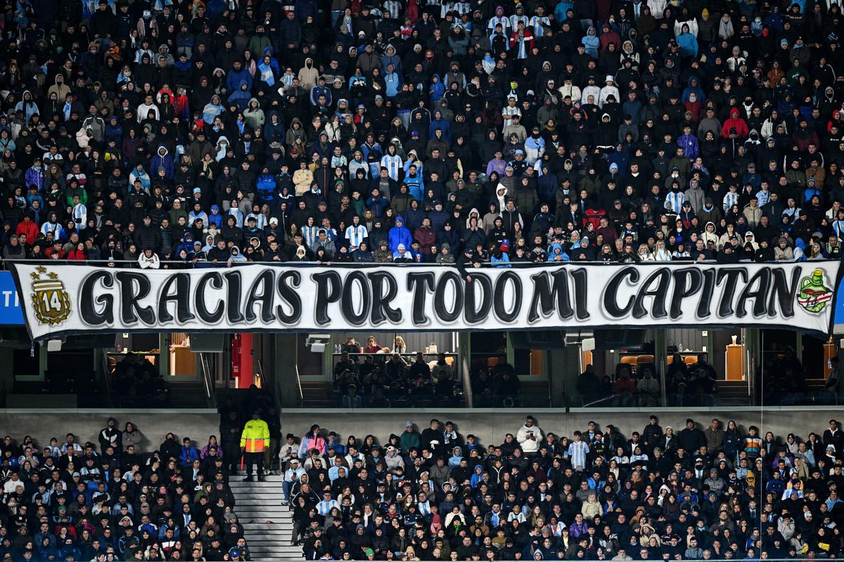 Argentina fans display a banner for Lionel Messi in the stands