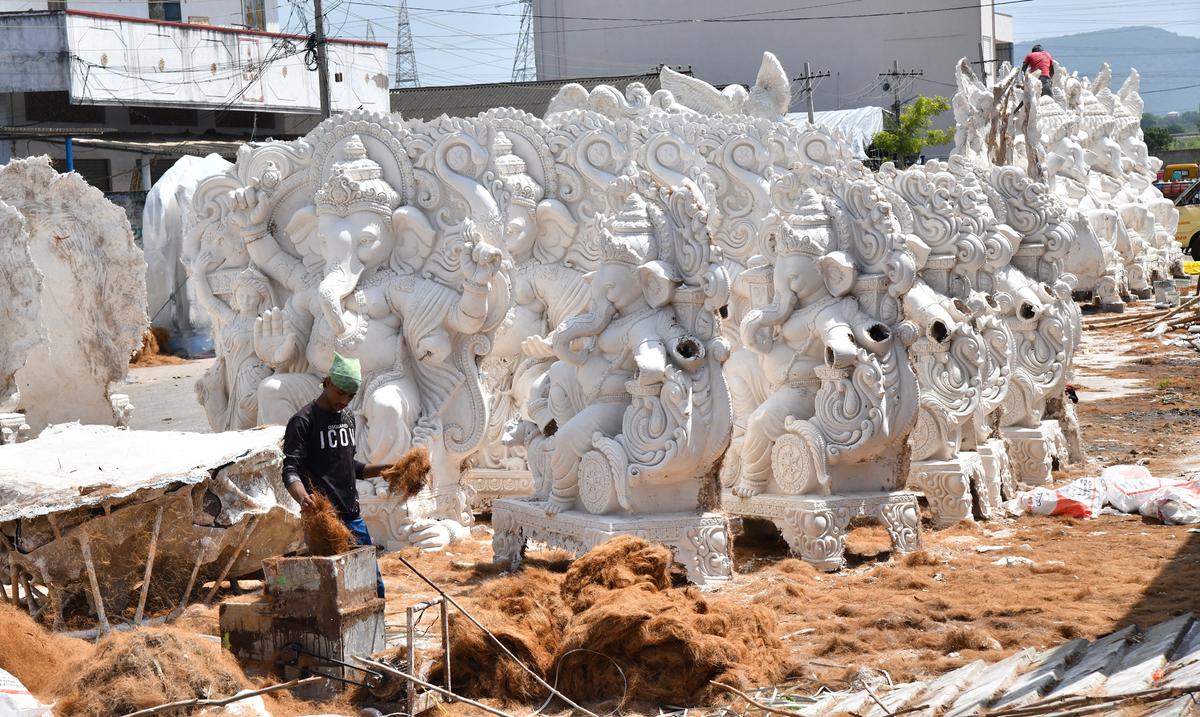 Artisans busy crafting various types of Ganesh idols at Nunna Mango Market in Vijayawada.