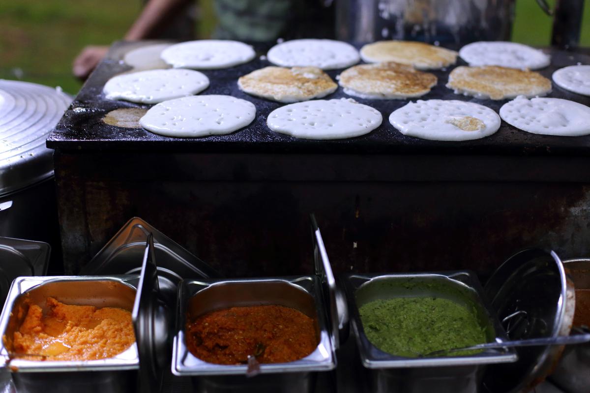 Dosas served with different side dishes at this thattukada in Thiruvananthapuram