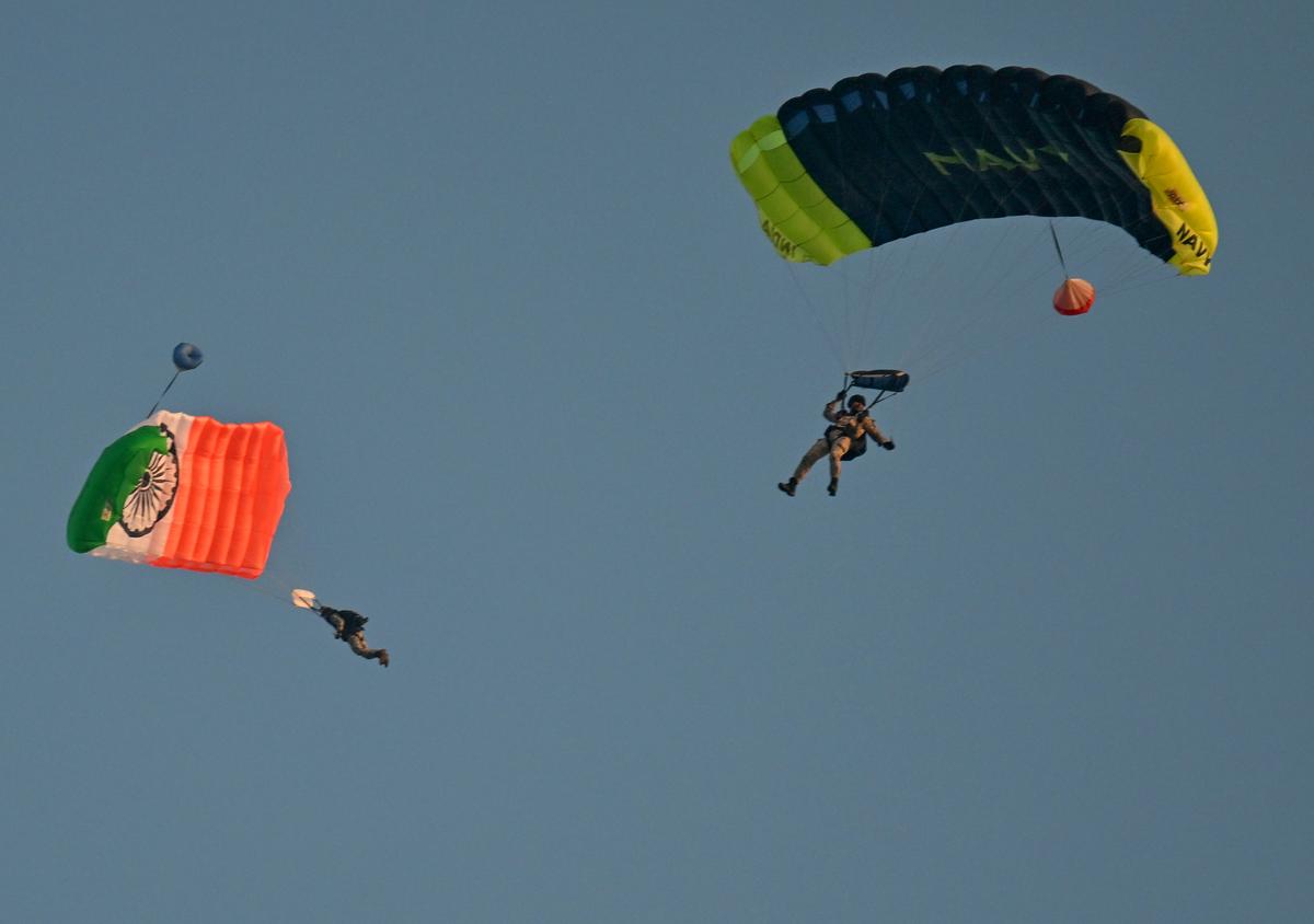 Skydiving team of the Indian Navy coming down during the rehearsals for the Operational Demonstration of Indian Navy in Visakhapatnam.